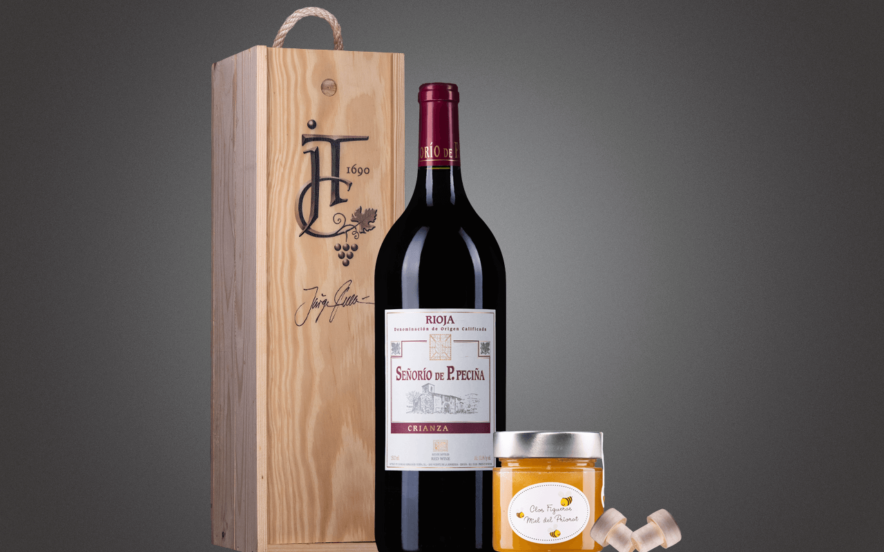 JTC 1er Magnum-Holzkiste "Rioja Crianza Rotwein mit Honig" als Präsent verpackt (Abholpreis Vinothek) JTC 1er Magnum-Holzkiste "Rioja Crianza Rotwein mit Honig" als Präsent verpackt (Abholpreis Vinothek)